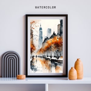 May include: A watercolor painting of a city street scene with tall buildings, trees with orange leaves, and people walking on a sidewalk. The street is wet from rain and reflects the buildings and trees. The painting is framed in black.