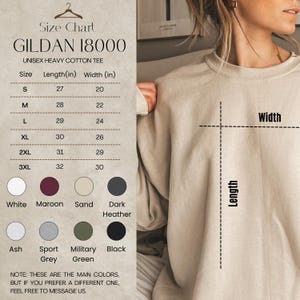 Op de afbeelding: Maattabel voor Gildan 18000 unisex heavy cotton T-shirts. De tabel toont maten S t/m 3XL, met lengte- en breedtematen in inches. Kleuropties zijn wit, bordeaux, zand, donkergrijs, as, sportgrijs, legergroen en zwart.