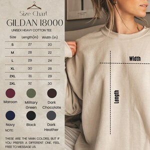 May include: A size chart for a Gildan 18000 unisex heavy cotton tee. The chart lists sizes S to 3XL, with length and width measurements in inches. Colors include maroon, military green, dark chocolate, navy, black, and dark heather.