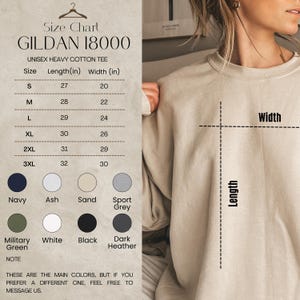 May include: A size chart for a Gildan 18000 unisex heavy cotton tee. The chart shows measurements in inches for sizes S to 3XL. Colors include navy, ash, sand, sport grey, military green, white, black, and dark heather.