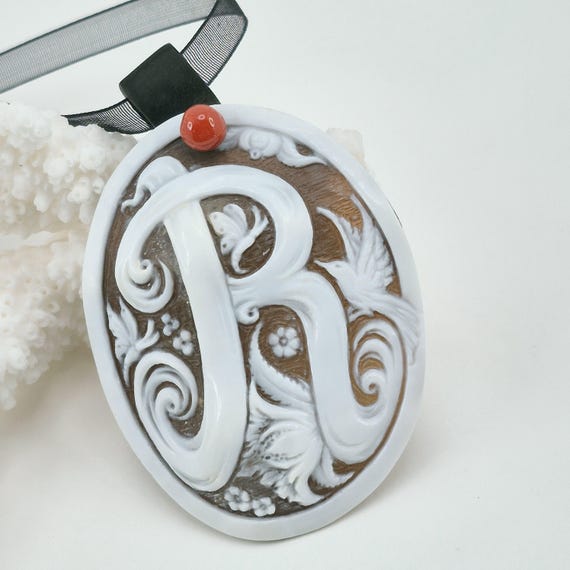 Cameo pendant engraved on Cassis Madagascariensis shell, letter R, Mediterranean coral button, ebony hook