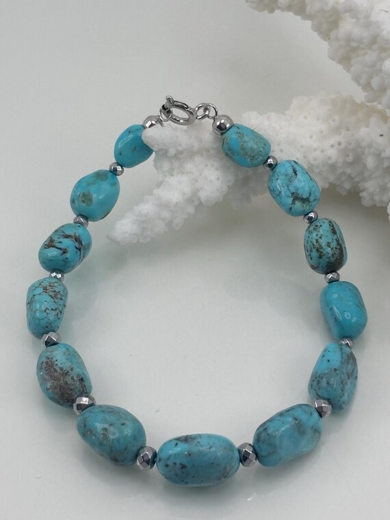Bracelet in TURQUOISE stones and grey hematite with 925 SILVER clasp.