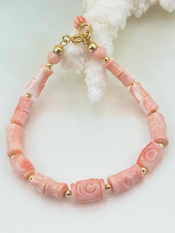 Bracciale in CORALLO rosa proveniente dai Mari asiatici, cannettoni alternati da ematite dorata e chiusura in ARGENTO 925 placcato oro