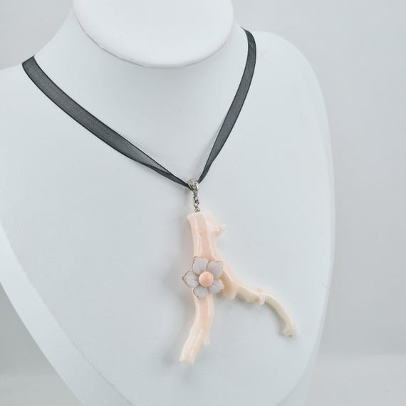 Pink coral branch and cameo flower