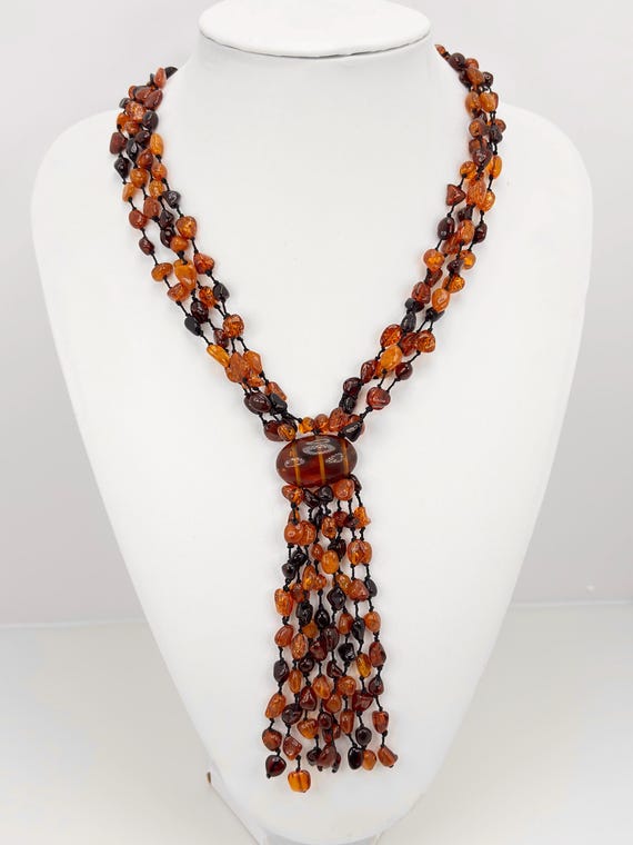 Necklace made of AMBER pebbles and fabric, knotted