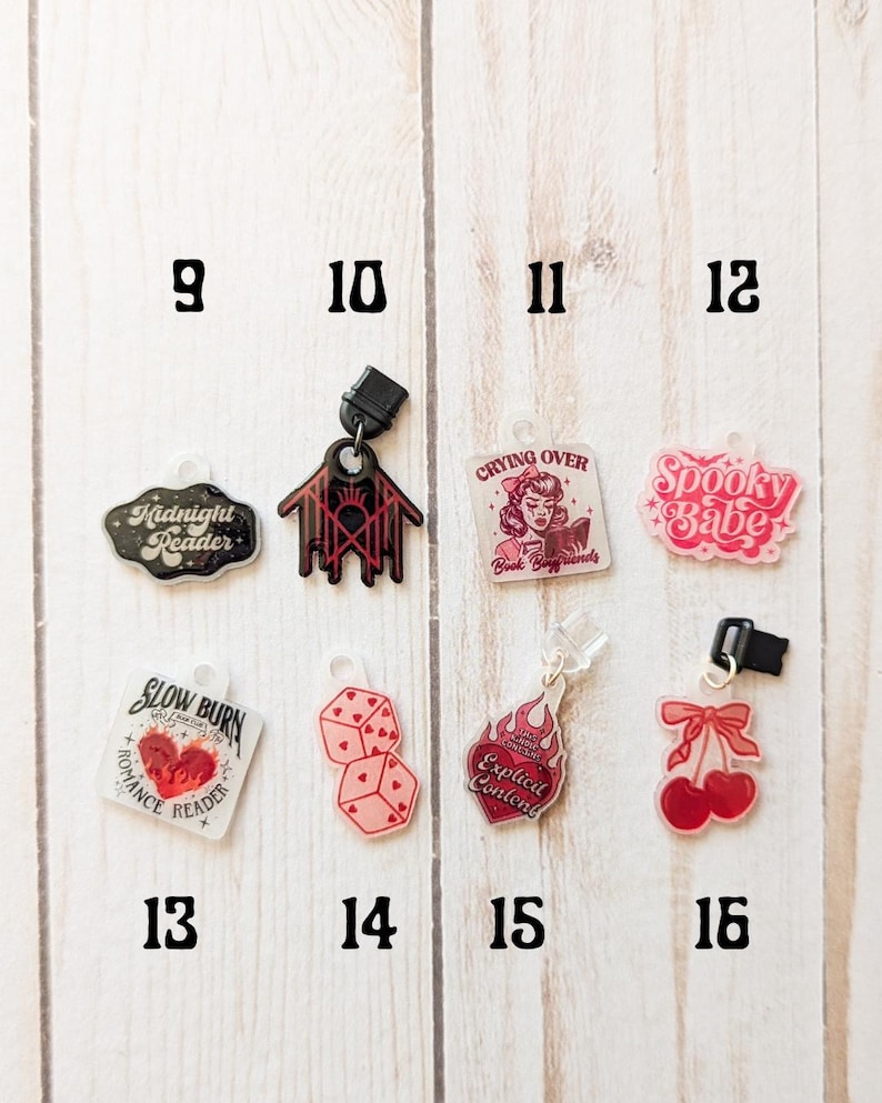 May include: A set of 10 bookish charms with various designs, including a spooky babe, a crying over book boyfriends charm, a slow burn romance reader charm, and a midnight reader charm. The charms are made of clear acrylic with black and red details.