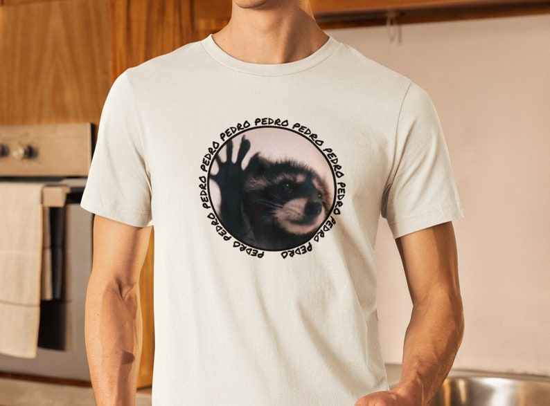 Pedro Raccoon Unisex Meme T-Shirt, Stylish Viral Animal Tee, Urban Wildlife Enthusiast Gift, Internet Meme Casual Wear Bild 1