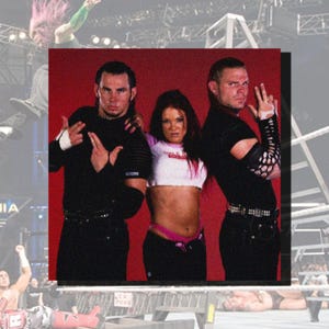 May include: Three people, two men and one woman, are standing in front of a red background. The men are wearing black shirts and black trousers. The woman is wearing a white shirt with a pink design, black trousers, and a pink belt. All three are making hand gestures.