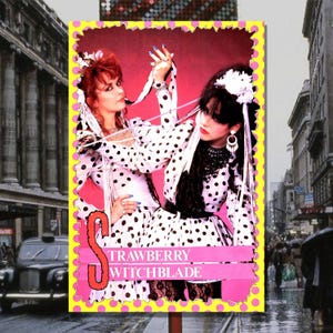 May include: A vintage promotional card featuring two women in black and white polka dot dresses. The card has a pink background with the text "Strawberry Witchblade" in white.
