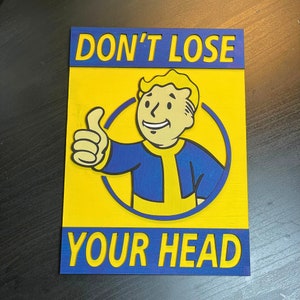 May include: A yellow and blue sign with the text "DON'T LOSE YOUR HEAD" and a cartoon character with a thumbs up.