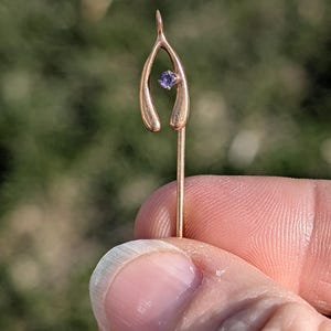 Adorable 10k/14k stickpin with wish bone and purple stone