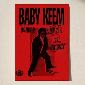 May include: A red poster with black text advertising a Baby Keem concert in Los Angeles on November 20th at the Roxy.