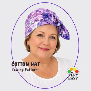 May include: A cotton hat sewing pattern featuring a purple and white floral print. The hat has a gathered design with a side tie detail. The text on the image reads Cotton Hat Sewing Pattern and Very Easy with a colorful circular icon.