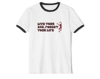 May include: White t-shirt with a black ringer and a red skeleton graphic. The text "Live your age, forget your life" is printed on the shirt.