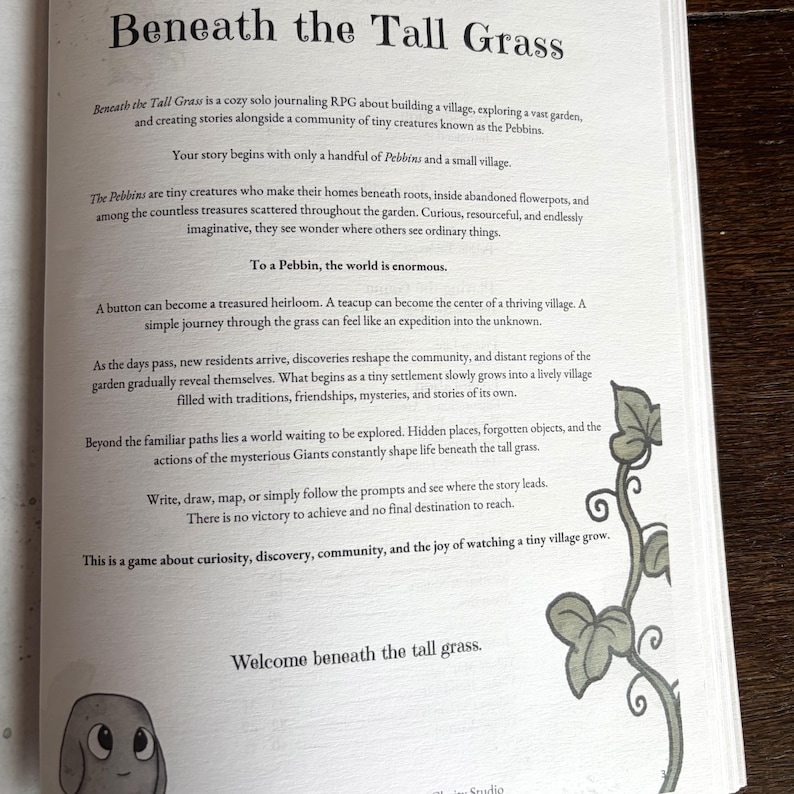 May include: A page from the solo journaling RPG Beneath the Tall Grass, featuring black text on a white background. The page describes the game premise, including the Pebbins creatures, and includes a small illustration of a vine and a character.