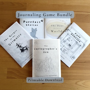 Può includere: Una raccolta di cinque libretti intitolata Journaling Game Bundle, che include The Keeper of the Grimoire, Purrfect Shelter, The Door Between Worlds, Café Stories e The Cartographer's Sea. Ogni libretto presenta illustrazioni e testo unici.