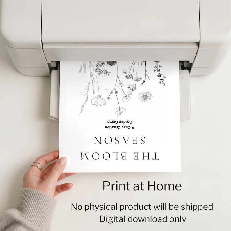 May include: A white sheet of paper with a floral design is being printed from a printer. The text on the paper reads "THE BLOOM SEASON" and "Print at Home". The image is a digital download.