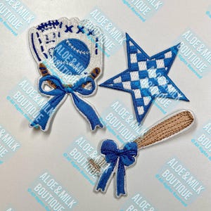 May include: Three embroidered iron-on patches featuring a baseball glove with a ball, a baseball bat with a blue bow, and a blue and white checkered star.