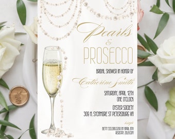 May include: A white invitation with gold lettering for a bridal shower. The invitation features a glass of champagne with pearls cascading down the side. The text reads "Pearls & Prosecco Bridal Shower in Honor of Catherine Smith Saturday, April 12th One O'Clock Oyster Society 309 11. Sycamore St Petersburg VA isop Betty 555.589.5200 by April 8th Registry: Zola.com"