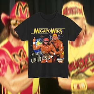 May include: Black t-shirt with a vintage wrestling graphic featuring two wrestlers with the text "MegaPowers" and "Strongest in the Universe".