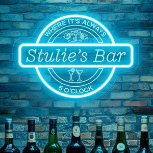 May include: A neon sign reading "Stulie's Bar" with the text "Where it's always 5 O'Clock" above a row of liquor bottles. The sign is blue and the background is a brick wall.