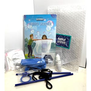 May include: A science experiment kit for making bubbles. The kit includes a book titled "Bubble Science", a bubble wand, a bottle of bubble solution, and a net for catching bubbles.