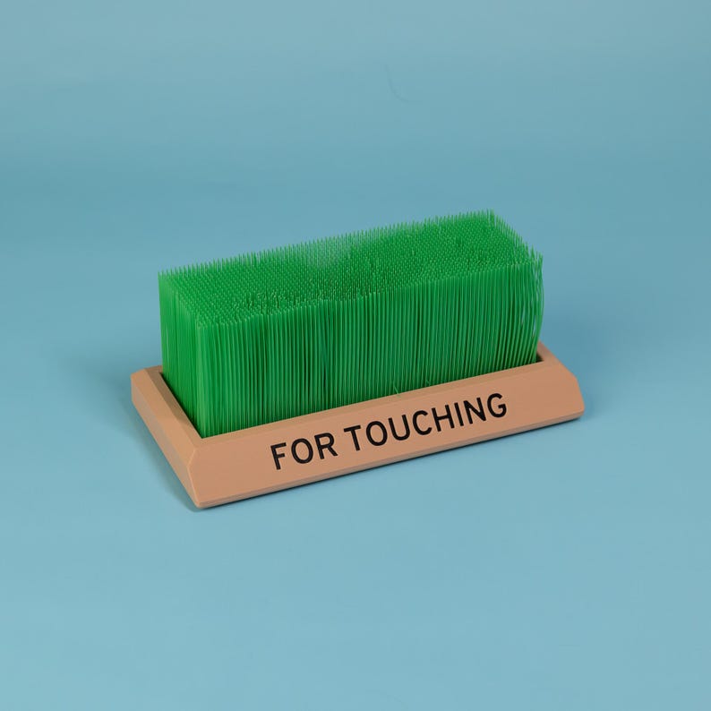 Touch Grass desk toy light brown base green grass funny desk accessory