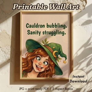 May include: Printable wall art in a wooden frame. The artwork features a cartoon witch with red hair and a green hat, with the text "Cauldron bubbling. Sanity struggling." The image includes the words "Instant Download".