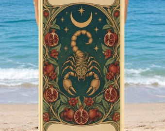 May include: A rectangular beach towel featuring a dark teal background with a central gold scorpion illustration, a crescent moon, and stars. The design includes pomegranate fruit and floral motifs, with the text SCORPIO and MAYA.