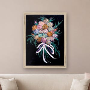 May include: A framed wall art print featuring a vibrant bouquet of flowers in shades of pink, orange, blue, and white against a solid black background. The floral arrangement is tied with a white ribbon and accented by green foliage outlines.