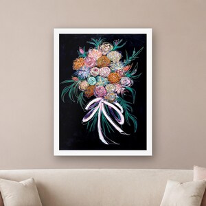 May include: A framed wall art print featuring a vibrant floral bouquet illustration against a solid black background. The bouquet consists of multi-colored flowers in shades of pink, orange, blue, and white, tied with a white ribbon.