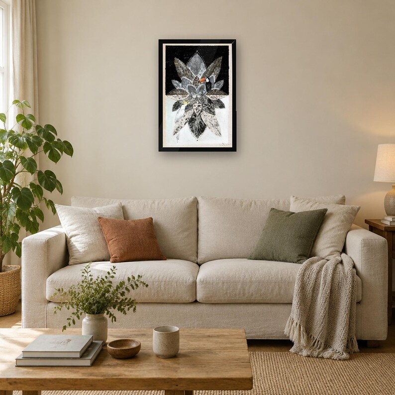 May include: A framed vertical wall art print featuring a stylized black and white botanical arrangement of layered leaves. A small toucan with a bright orange beak is perched among the foliage. The artwork is set against a dark background.