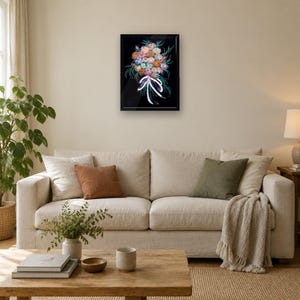 May include: A framed wall art piece featuring a vibrant, multi-colored floral bouquet illustration against a solid black background. The bouquet is tied with a white ribbon and includes various shades of pink, orange, blue, and green.