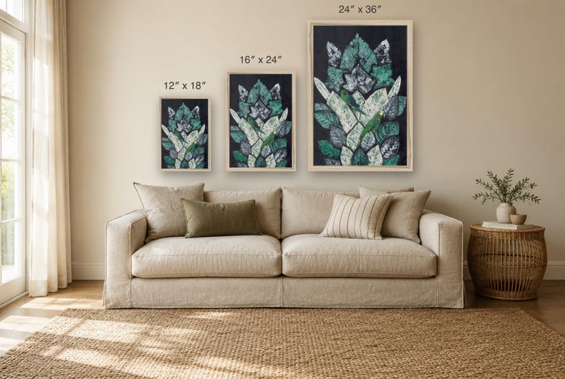 May include: Three framed rectangular wall art prints featuring a green and white leaf pattern on a black background. The prints are labeled with dimensions of 12" x 18", 16" x 24", and 24" x 36" respectively, displayed in light wood frames.