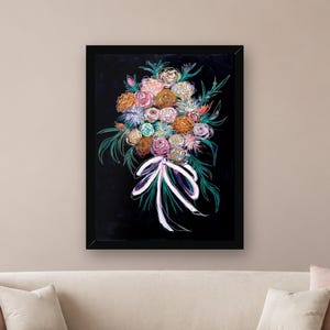 May include: A framed wall art print featuring a vibrant bouquet of flowers in shades of pink, orange, blue, and white against a solid black background. The floral arrangement is tied with a white ribbon and accented by green foliage.