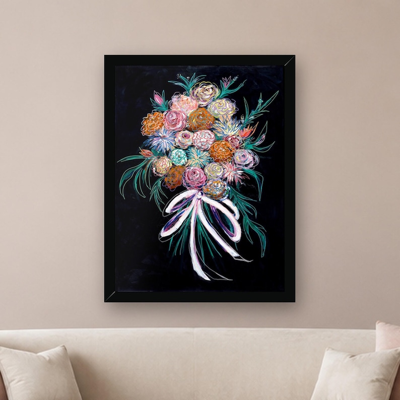 May include: A framed wall art print featuring a vibrant bouquet of flowers in shades of pink, orange, blue, and white against a solid black background. The floral arrangement is tied with a white ribbon and accented by green foliage.