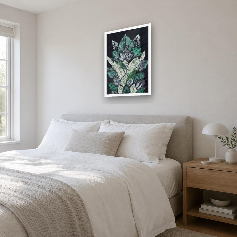 May include: A rectangular wall art print featuring a vertical arrangement of overlapping leaf shapes in shades of dark green, light green, and white against a black background, framed in a simple white border.
