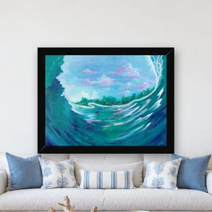 May include: A framed painting depicting a large ocean wave curling over, revealing a view of a distant green coastline and a light blue sky with soft pink clouds. The water transitions from deep teal to lighter turquoise tones.