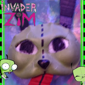 May include: A green and purple cartoon character with large eyes and a stitched-on nose. The character is from the animated television show "Invader Zim".