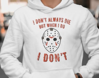 May include: White hoodie with a red graphic print of a hockey mask and the text "I don't always die but when I do I don't".