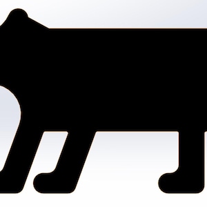 May include: A black bear silhouette with a small, rounded tail and a tan nose. The bear is depicted in a side profile, walking on four legs. The background is white.