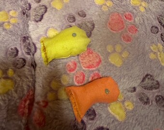 small pink and yellow fish cat toy simple made to be played with