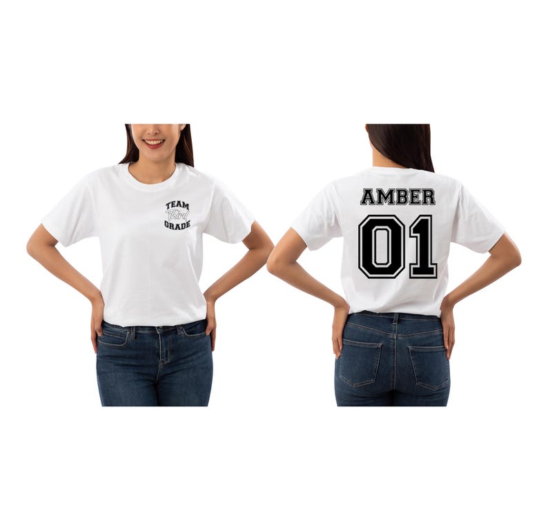 May include: White t-shirts with black text. One shirt reads "TEAM [heart] GRADE" on the front. The other shirt has "AMBER 01" on the back. Both shirts are short-sleeved and worn with blue jeans.