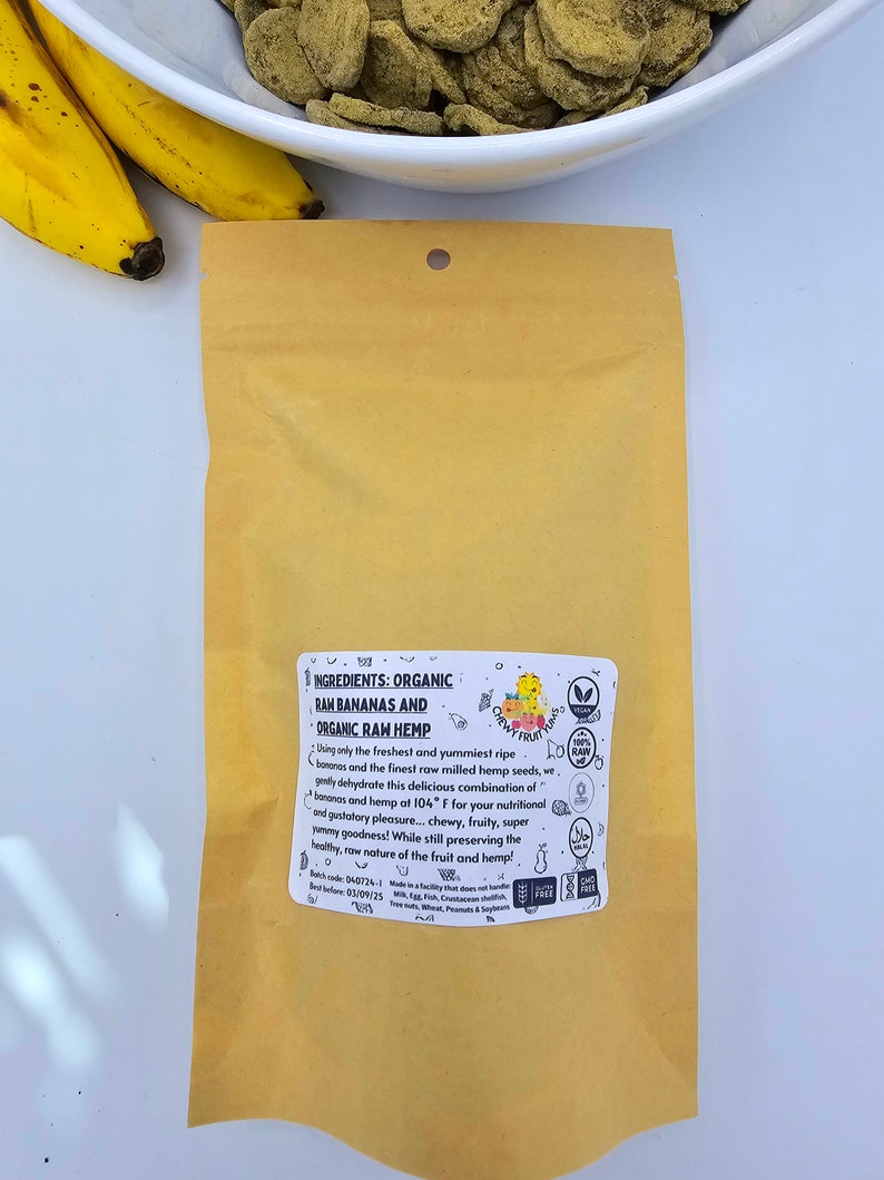 May include: A brown paper bag with a label that reads "INGREDIENTS: ORGANIC RAH BANANAS AND ORGANIC RAW HEMP". The label also includes a logo with the text "Chewy Fruitritious" and a list of ingredients.