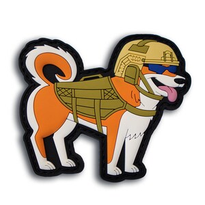 May include: A cartoon-style patch featuring a dog wearing a military helmet, sunglasses, and tactical gear. The dog is orange and white with a black outline. The dog has its tongue sticking out and is smiling. The patch has a black border.