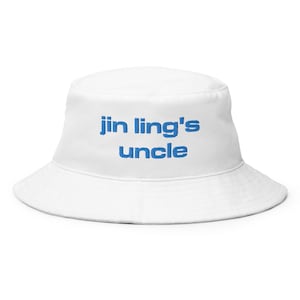 May include: White bucket hat with blue embroidered text that reads "jin ling's uncle"
