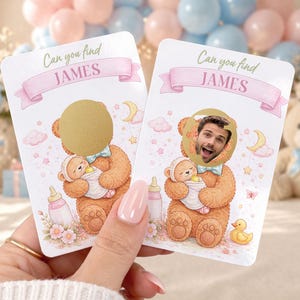 May include: Two baby shower game cards with a teddy bear design. The cards feature the text "Can you find JAMES" and a space for a photo. One card has a gold circle covering the face, and the other has a man's face.