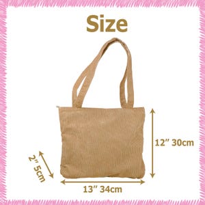 May include: Tan corduroy tote bag with matching handles. The bag is 13 inches wide, 12 inches tall, and 2 inches deep. The word "Size" is printed at the top of the image.