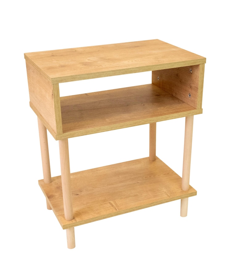 May include: A light wood end table with two shelves and four turned legs. The table is made of a light wood with a natural finish.