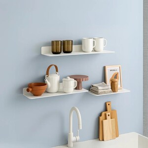 Storico Metal Shelf | Black floating wall shelf | Modern metal wall shelf | Bent steel picture ledge for bedroom | Simple plant shelf